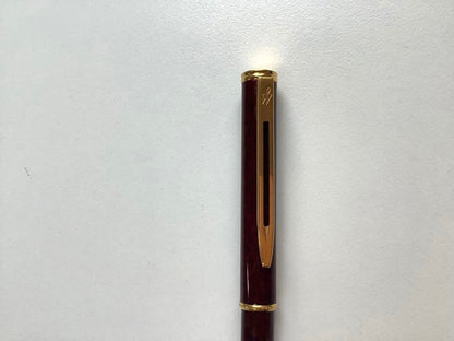 Used Waterman ballpoint pen without ink cartridge displayed on white background
