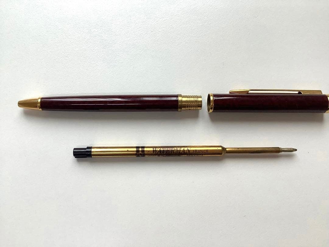 Used Waterman ballpoint pen without ink cartridge displayed on white background