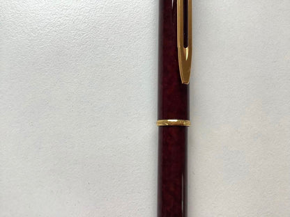 Used Waterman ballpoint pen without ink cartridge displayed on white background