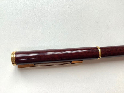 Used Waterman ballpoint pen without ink cartridge displayed on white background