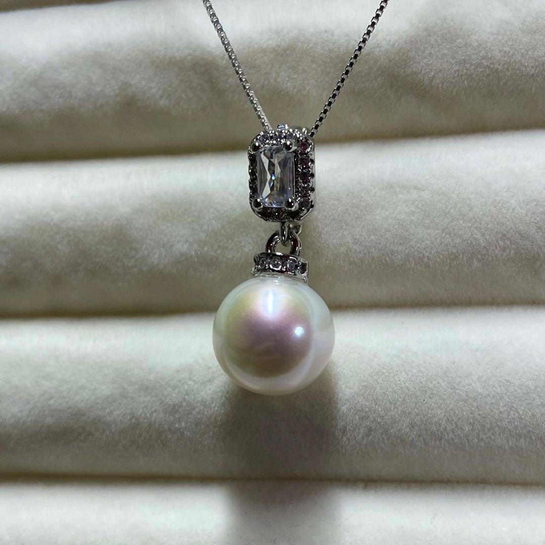 Akoya pearl necklace with 10mm large white pearls and silver pendant featuring baguette and melee stones