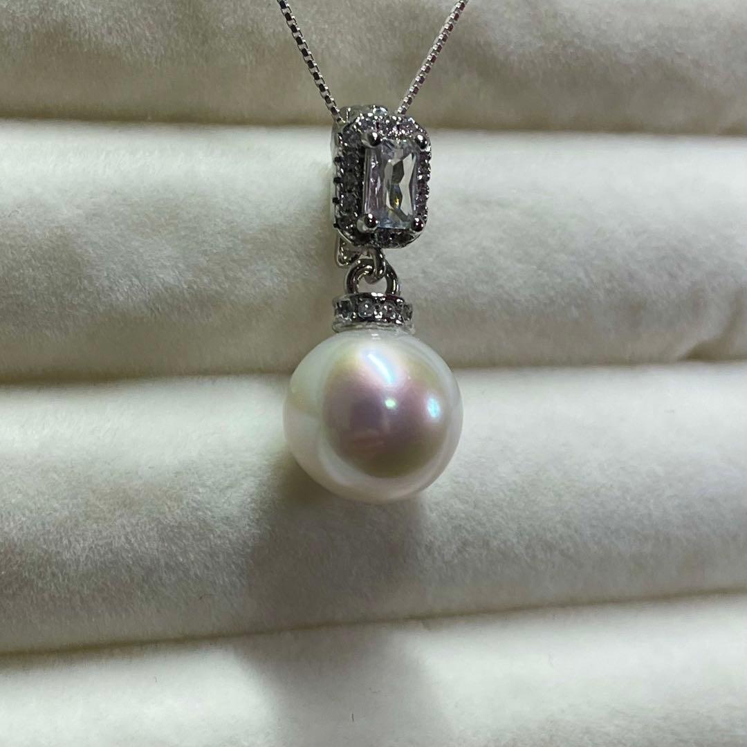 Akoya pearl necklace with 10mm large white pearls and silver pendant featuring baguette and melee stones
