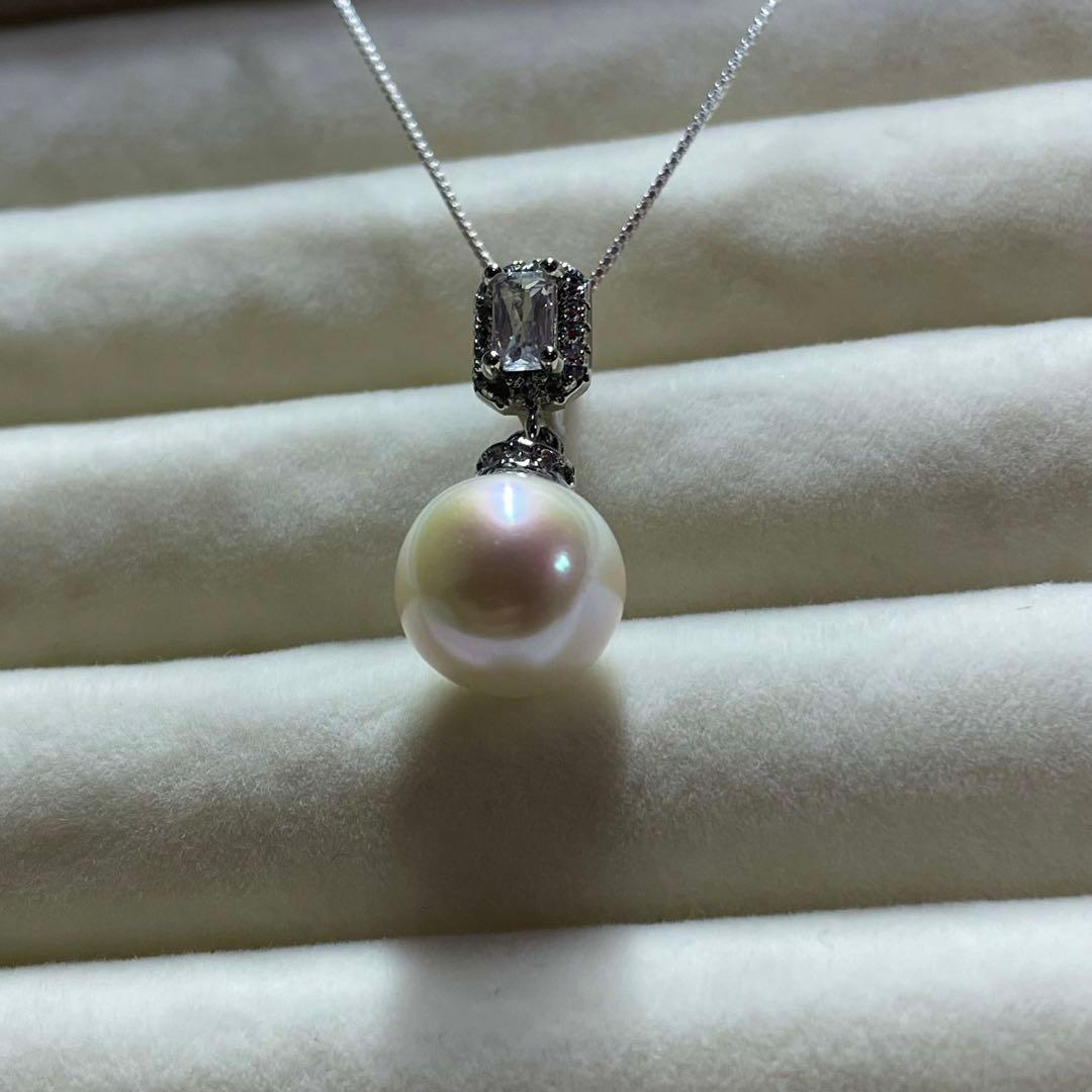 Akoya pearl necklace with 10mm large white pearls and silver pendant featuring baguette and melee stones
