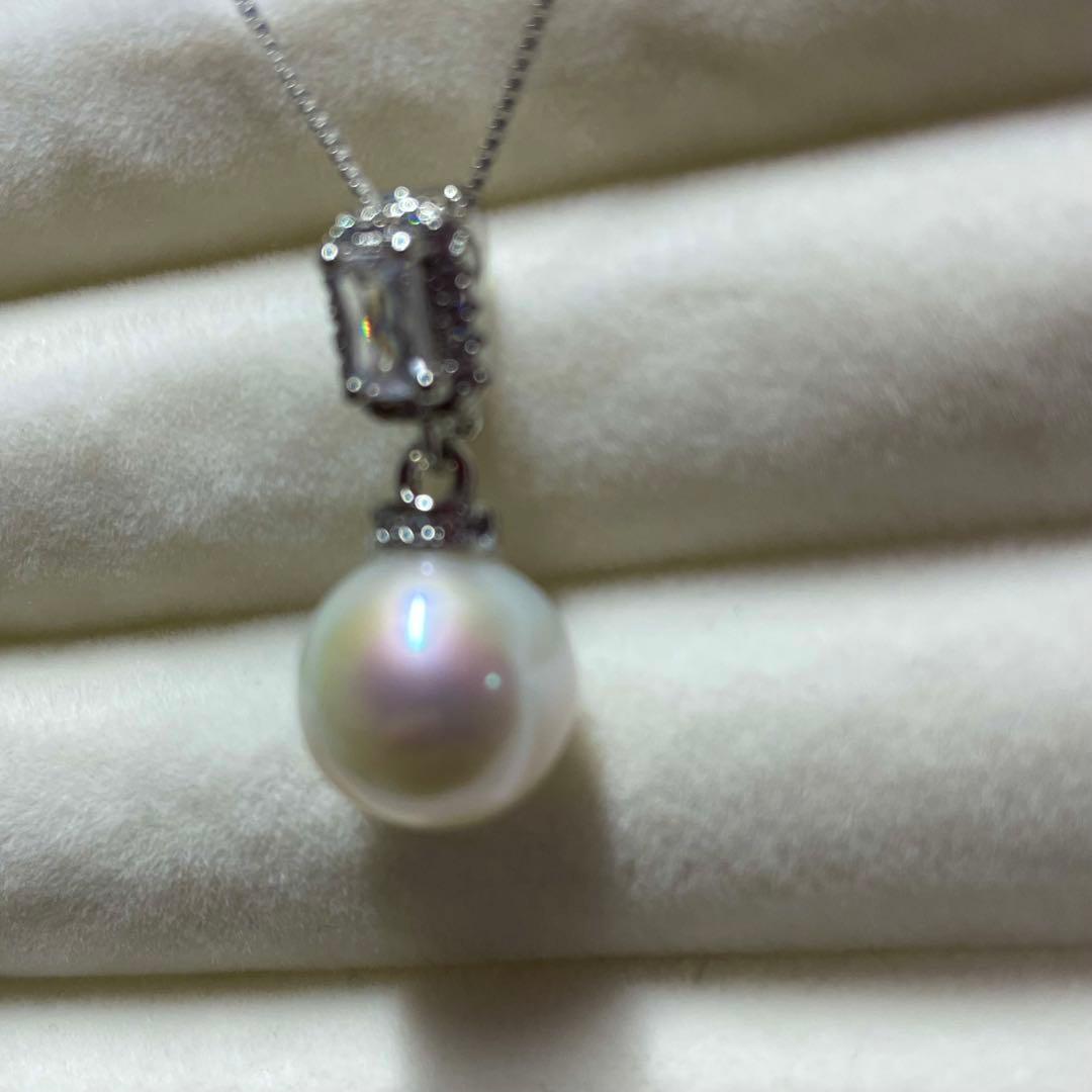 Akoya pearl necklace with 10mm large white pearls and silver pendant featuring baguette and melee stones