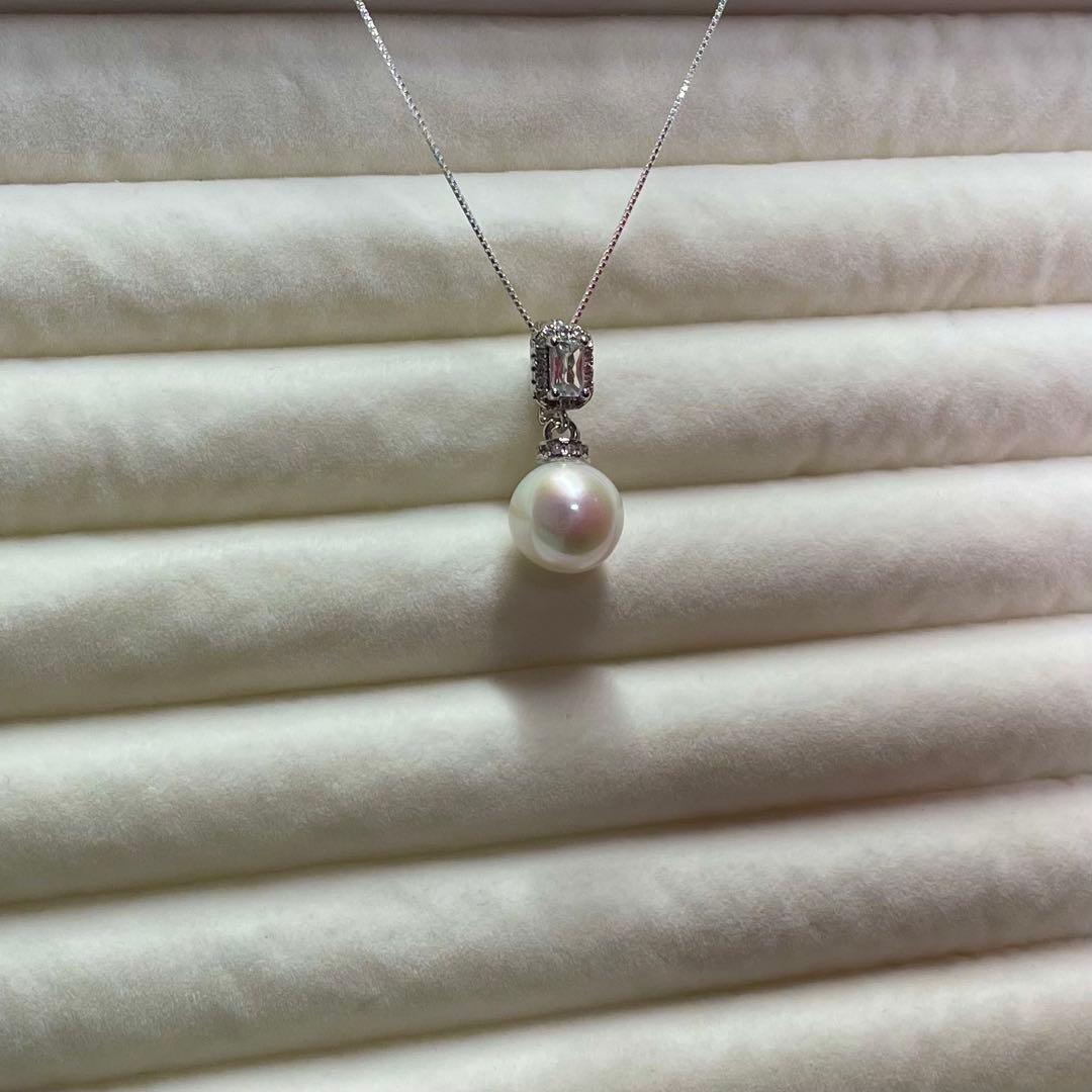 Akoya pearl necklace with 10mm large white pearls and silver pendant featuring baguette and melee stones
