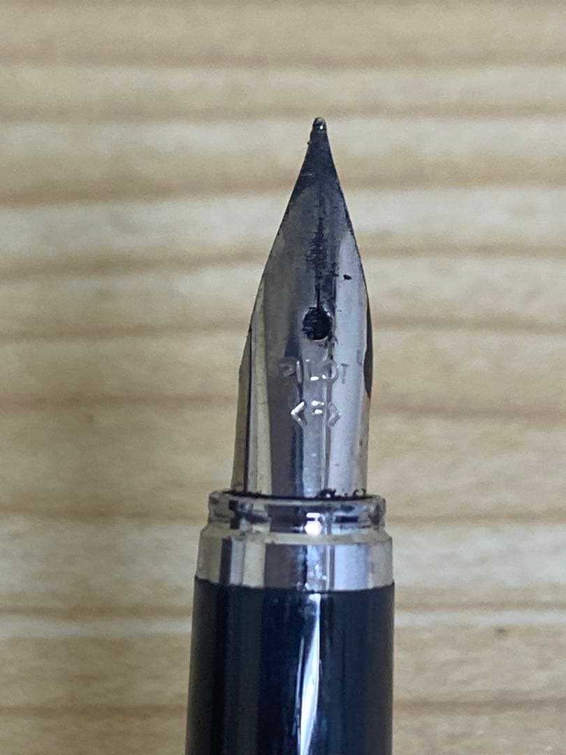 Pilot Cavalier Fountain Pen in pink with fine (F) tip shown uncapped on white background
