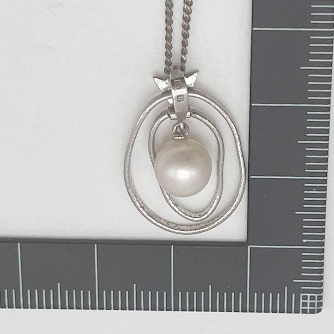 Mikimoto necklace with one cultured white pearl bead on a silver chain with Mikimoto engraved clasp