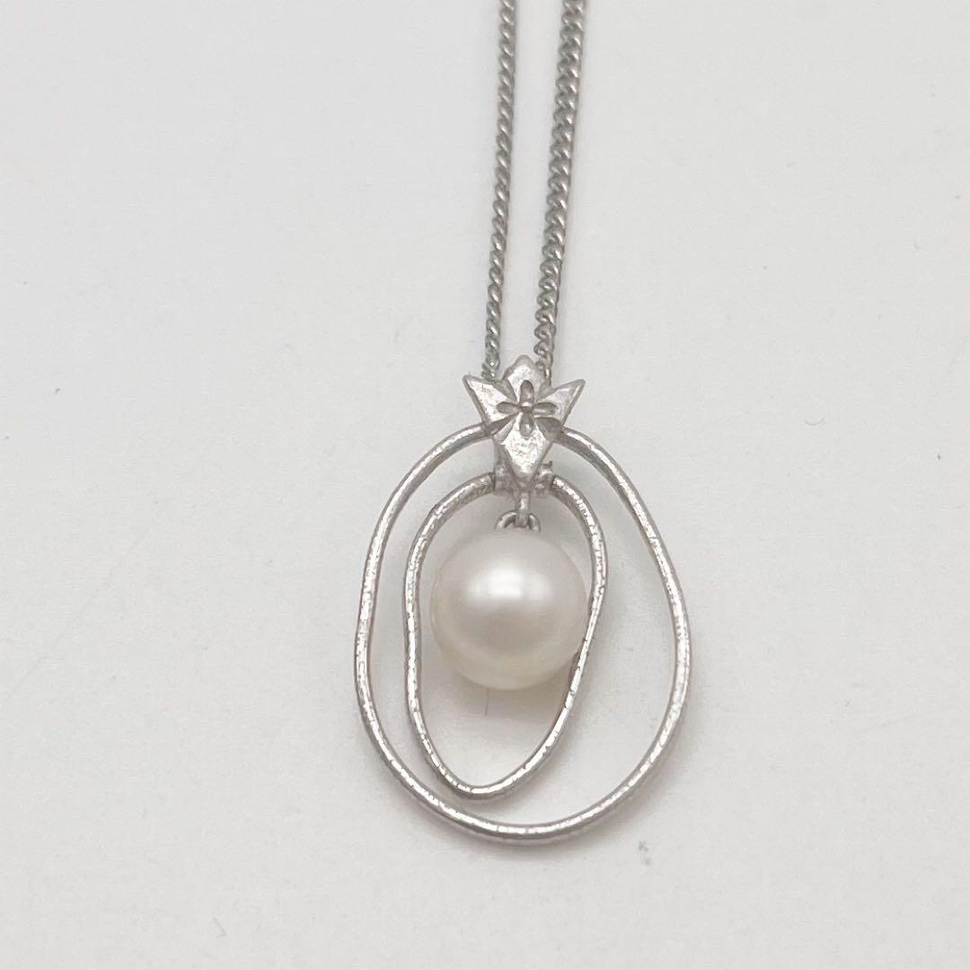 Mikimoto necklace with one cultured white pearl bead on a silver chain with Mikimoto engraved clasp