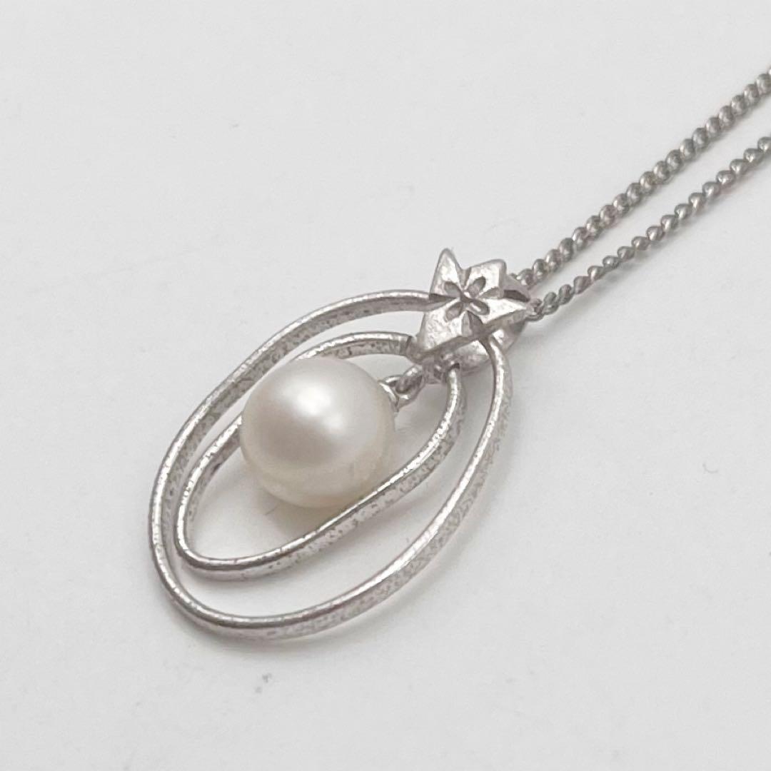 Mikimoto necklace with one cultured white pearl bead on a silver chain with Mikimoto engraved clasp
