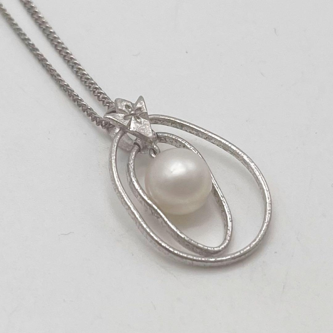 Mikimoto necklace with one cultured white pearl bead on a silver chain with Mikimoto engraved clasp