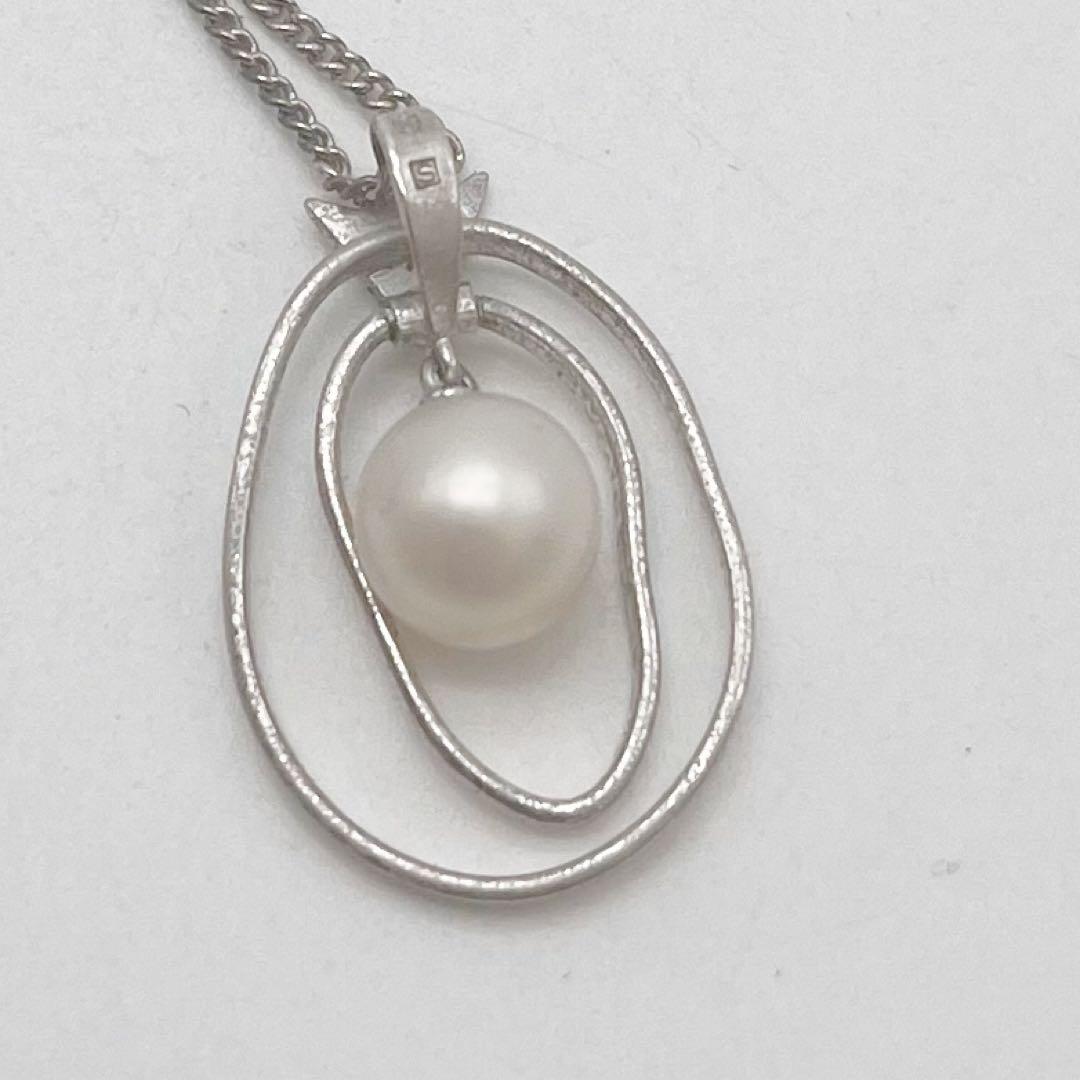 Mikimoto necklace with one cultured white pearl bead on a silver chain with Mikimoto engraved clasp