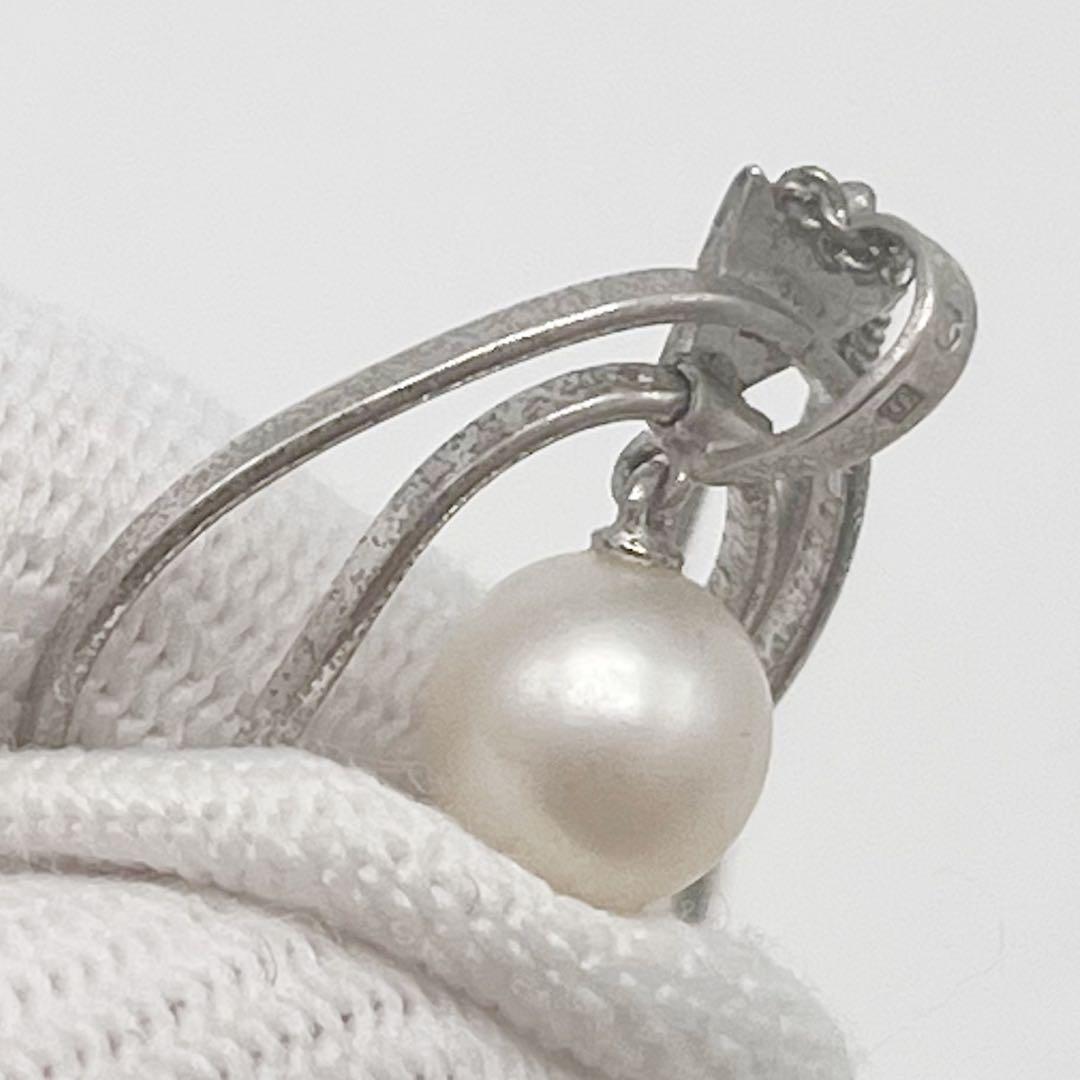 Mikimoto necklace with one cultured white pearl bead on a silver chain with Mikimoto engraved clasp