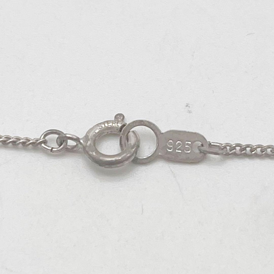 Mikimoto necklace with one cultured white pearl bead on a silver chain with Mikimoto engraved clasp