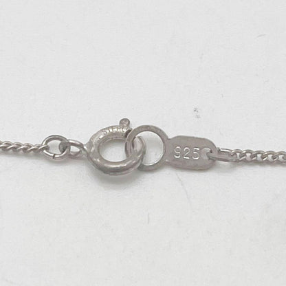 Mikimoto necklace with one cultured white pearl bead on a silver chain with Mikimoto engraved clasp