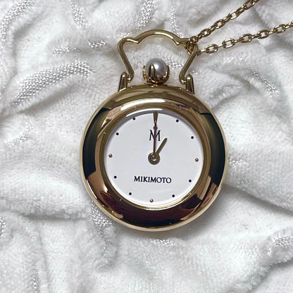Mikimoto pendant watch with 4mm pearl and 2.5cm clock on a 70cm chain with clock stand