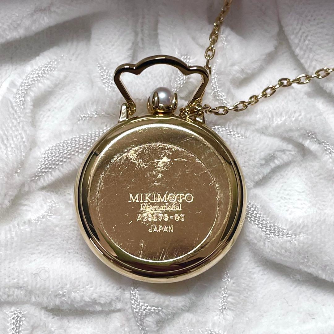 Mikimoto pendant watch with 4mm pearl and 2.5cm clock on a 70cm chain with clock stand