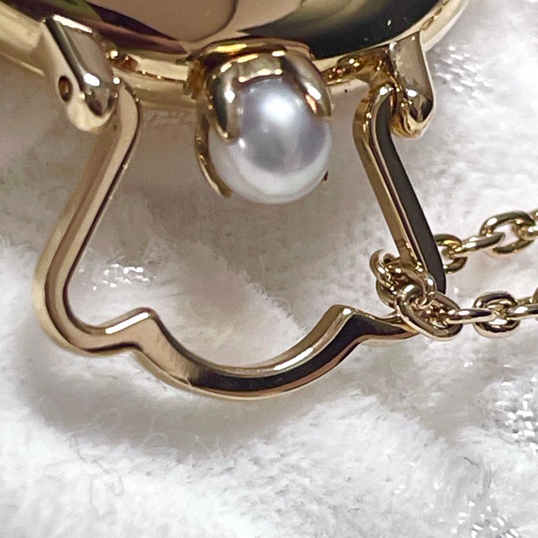 Mikimoto pendant watch with 4mm pearl and 2.5cm clock on a 70cm chain with clock stand