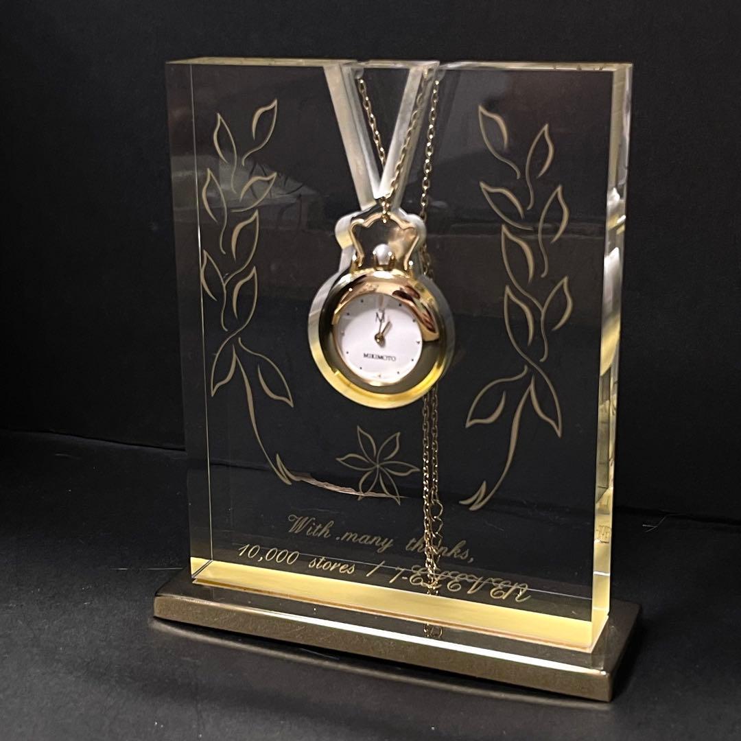 Mikimoto pendant watch with 4mm pearl and 2.5cm clock on a 70cm chain with clock stand