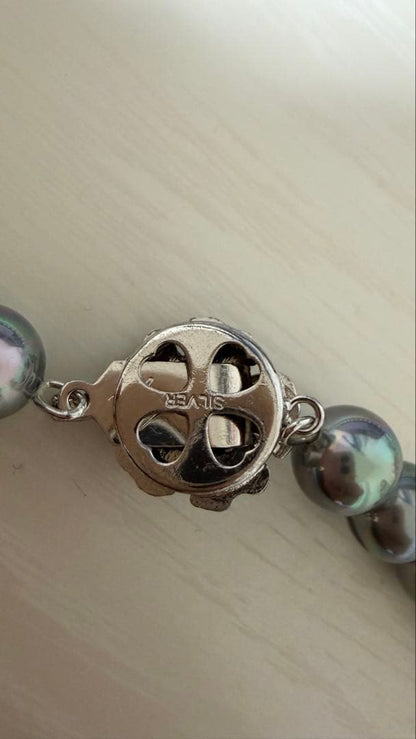 Akoya pearl necklace in silver with blue gray pearls, 43 cm length, displayed on white background