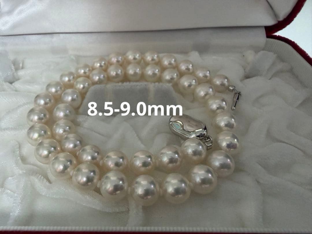 Two-piece Akoya pearl necklace with white pearls sized 8.5-9.0mm and about 5.0mm on silver stamp