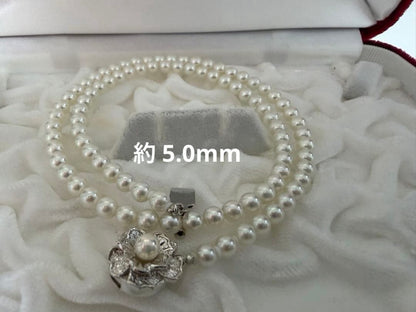 Two-piece Akoya pearl necklace with white pearls sized 8.5-9.0mm and about 5.0mm on silver stamp