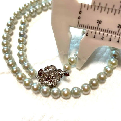 Akoya Pearl Necklace Aurora with 4.0-4.5mm white pink pearls and silver clasp on white background