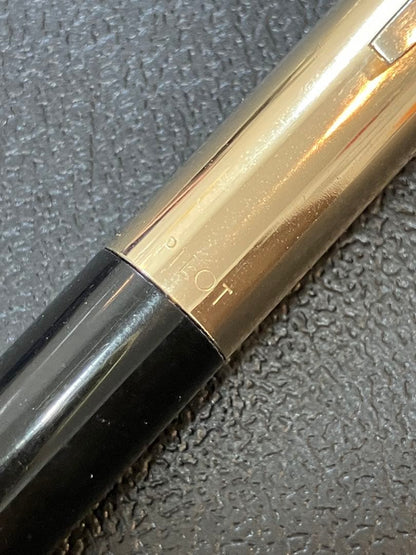 Pilot mechanical pencil in black and gold metal showing barrel and tip