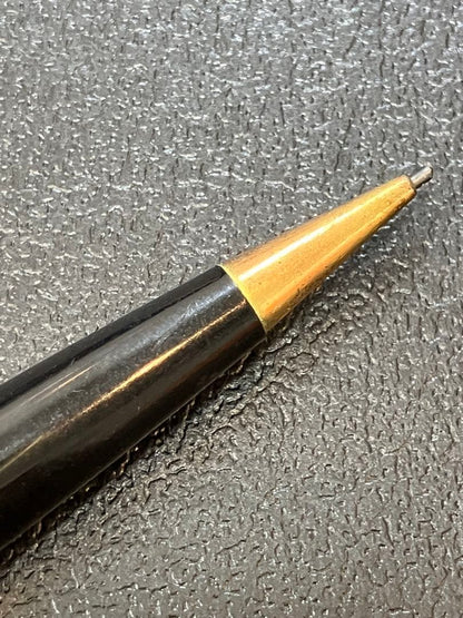 Pilot mechanical pencil in black and gold metal showing barrel and tip