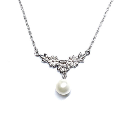 Mikimoto vintage pearl necklace with flower design in silver metal, 41cm length