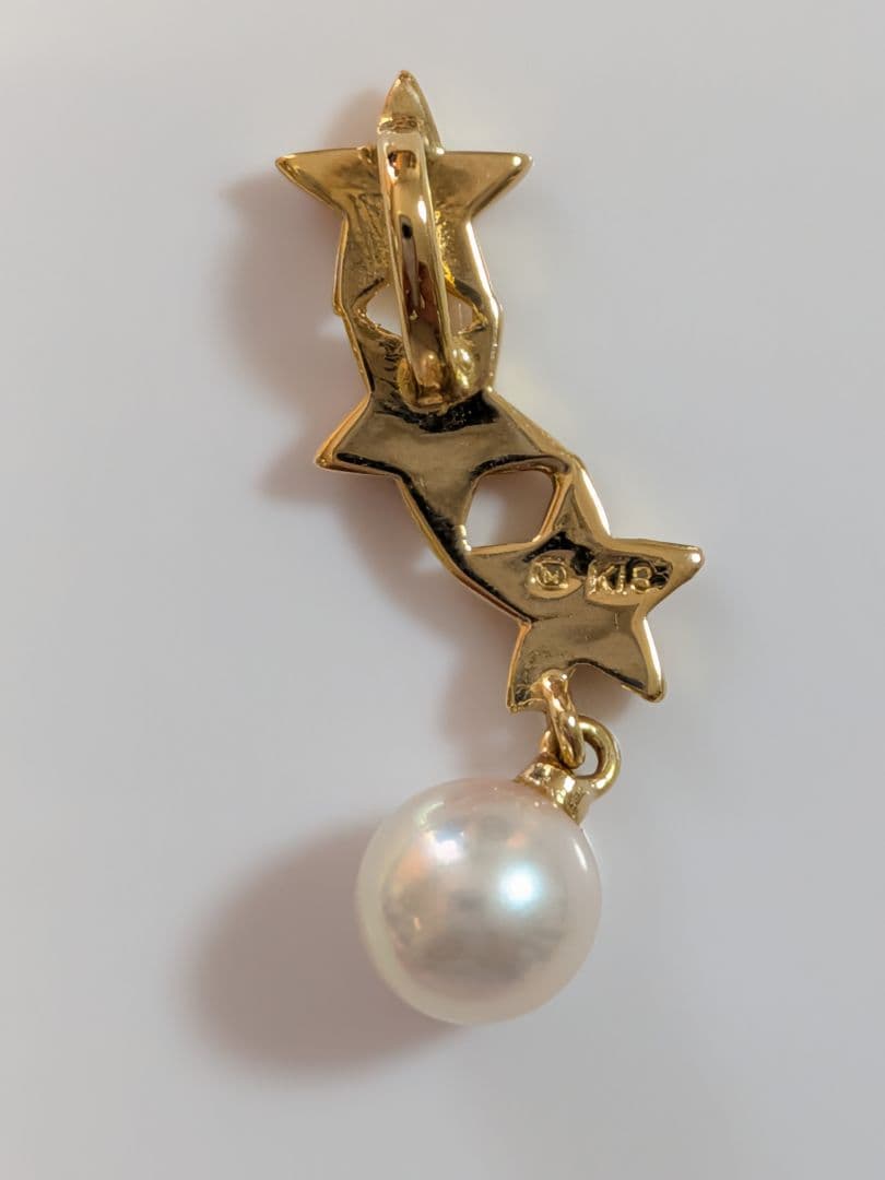 Mikimoto 18K gold necklace with star-shaped design and pearl pendant weighing approximately 3 grams