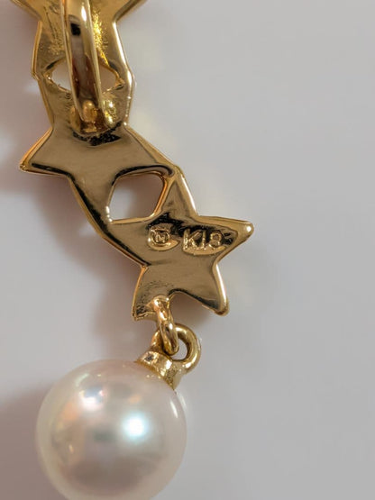 Mikimoto 18K gold necklace with star-shaped design and pearl pendant weighing approximately 3 grams
