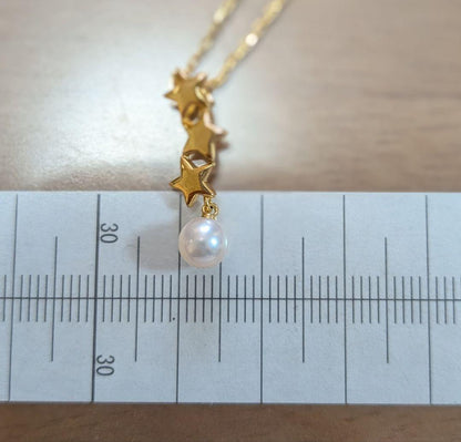 Mikimoto 18K gold necklace with star-shaped design and pearl pendant weighing approximately 3 grams