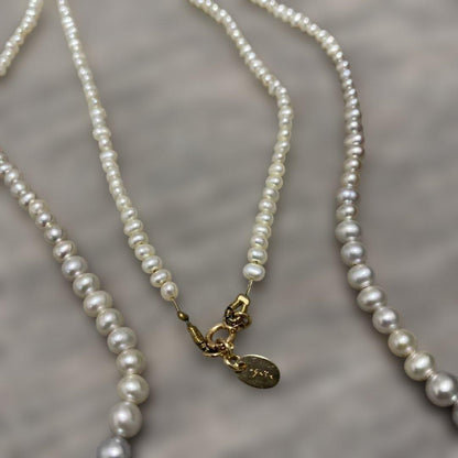 Agete Gradient Long Pearl Necklace measuring 100 cm with varying pearl sizes on a white background
