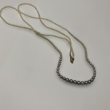 Agete Gradient Long Pearl Necklace measuring 100 cm with varying pearl sizes on a white background