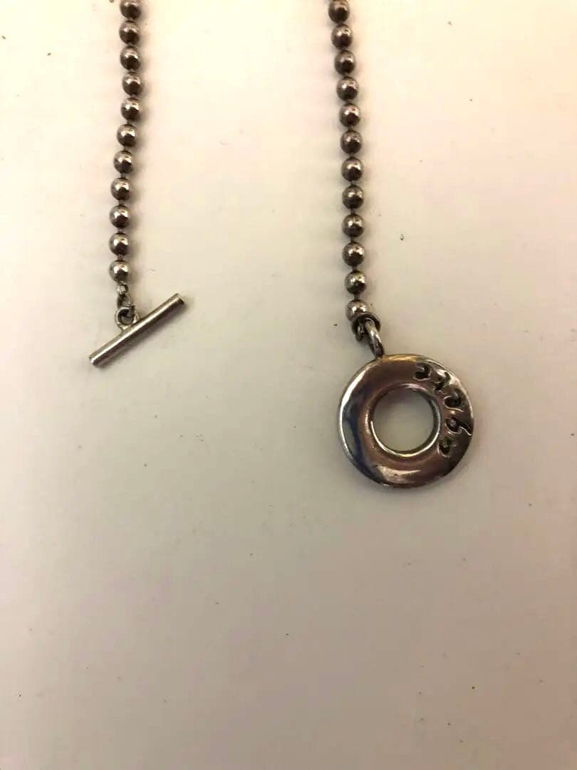 Agette 925 silver ball chain necklace paired with vintage Figaro chain on white background