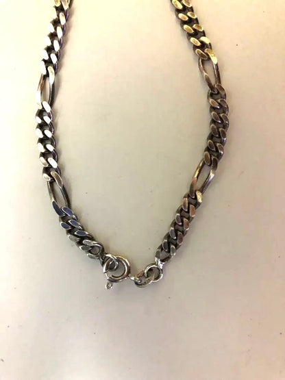 Agette 925 silver ball chain necklace paired with vintage Figaro chain on white background