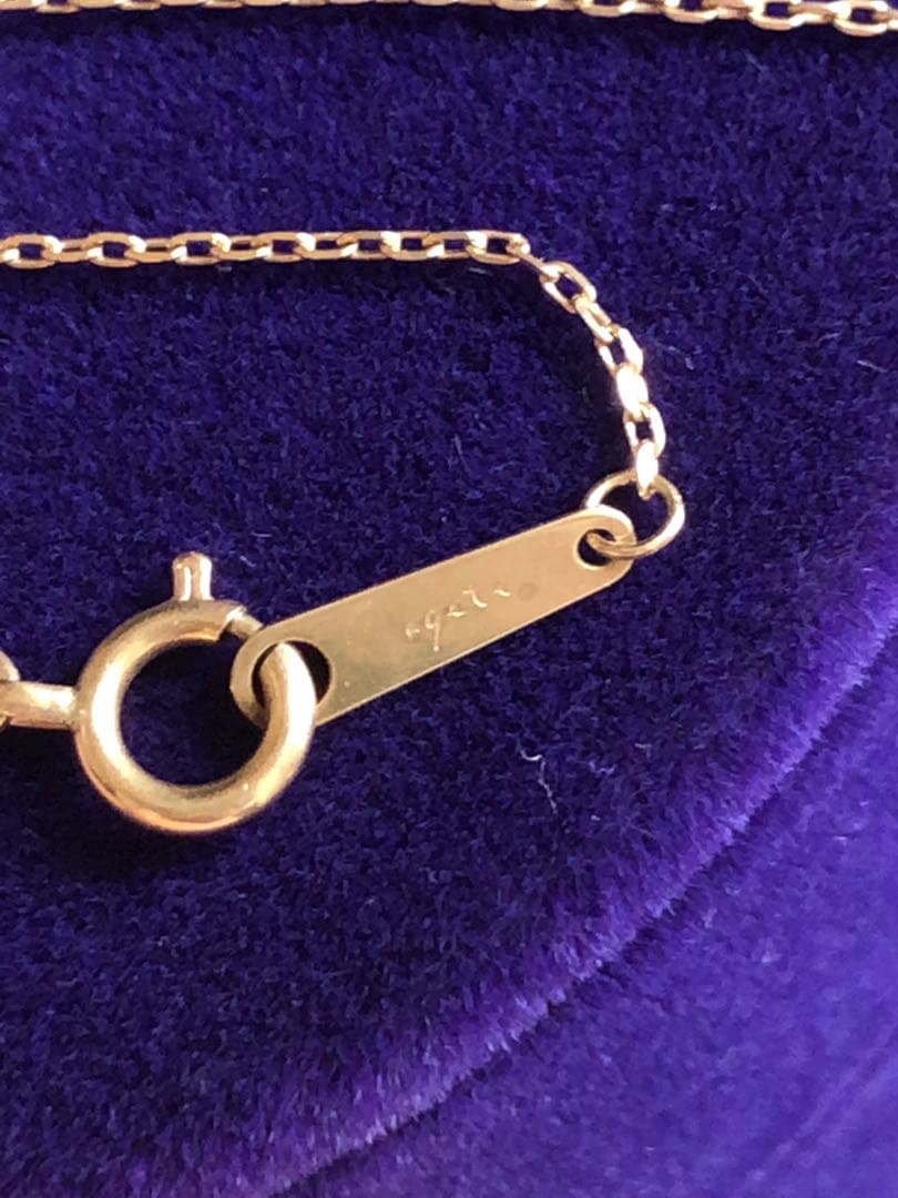 Agete K10 yellow gold necklace chain 40cm with attached earring charm on white background
