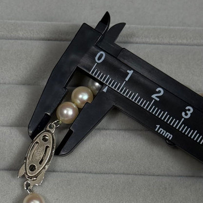Akoya pearl necklace with 6.5-7mm white pearls on a silver chain about 43cm long