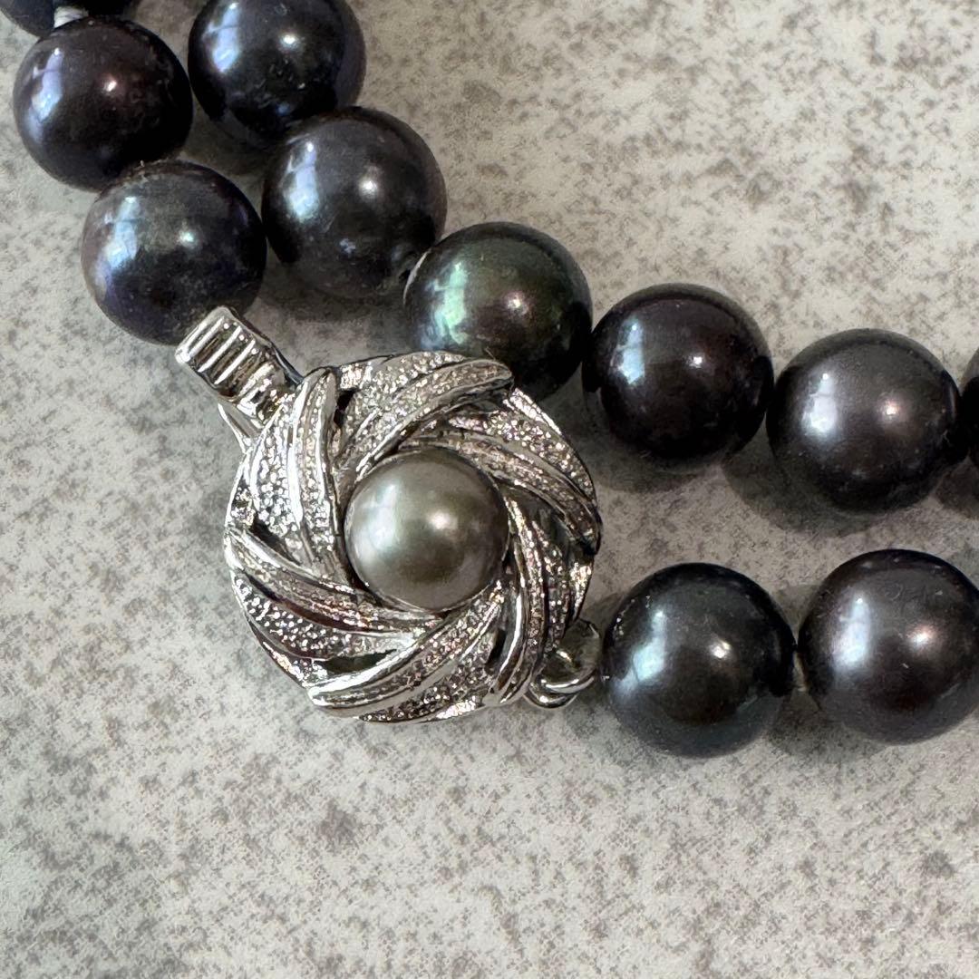 Honma Pearl genuine black Akoya pearl necklace with 7.4mm pearls and silver clasp on a white background