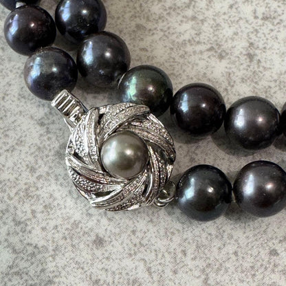 Honma Pearl genuine black Akoya pearl necklace with 7.4mm pearls and silver clasp on a white background