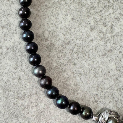 Honma Pearl genuine black Akoya pearl necklace with 7.4mm pearls and silver clasp on a white background