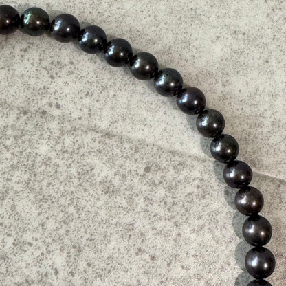 Honma Pearl genuine black Akoya pearl necklace with 7.4mm pearls and silver clasp on a white background