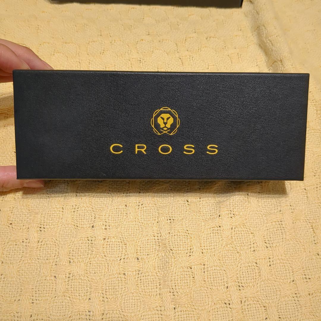Black leather CROSS ballpoint pen case with dedicated box on white background