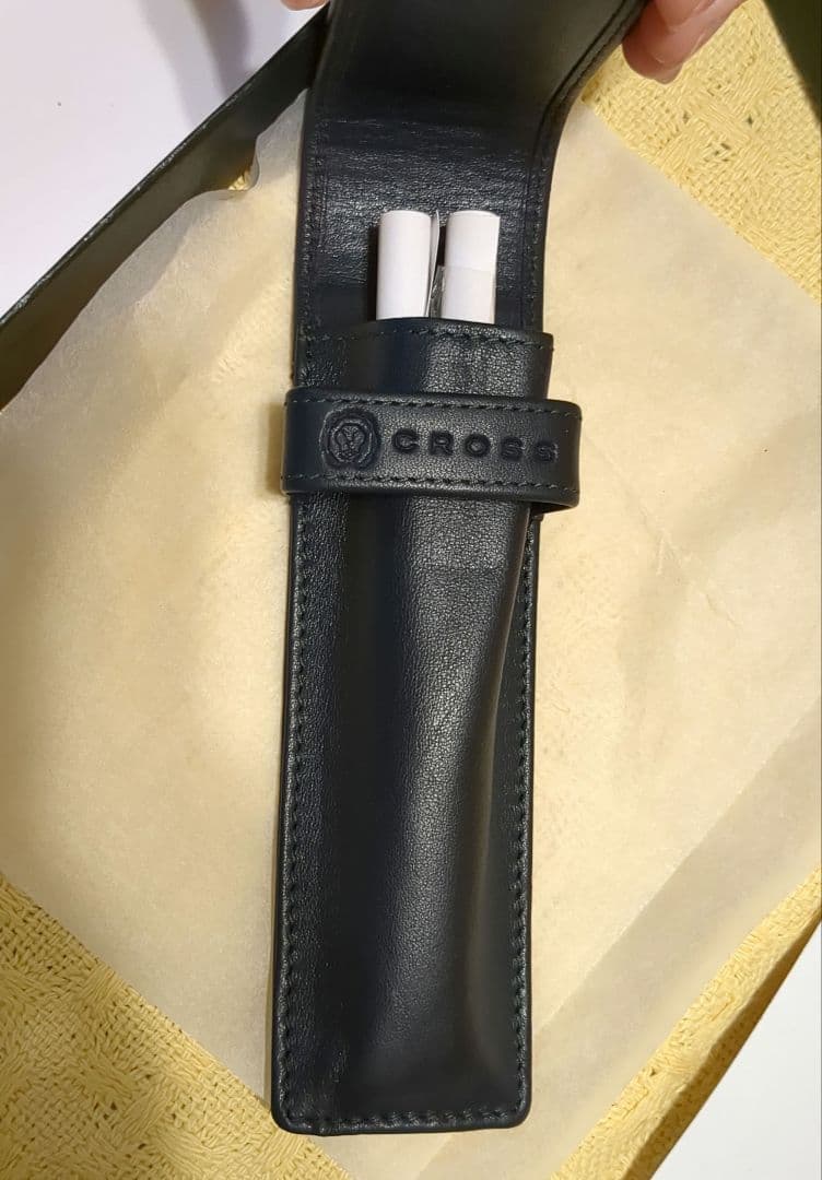 Black leather CROSS ballpoint pen case with dedicated box on white background