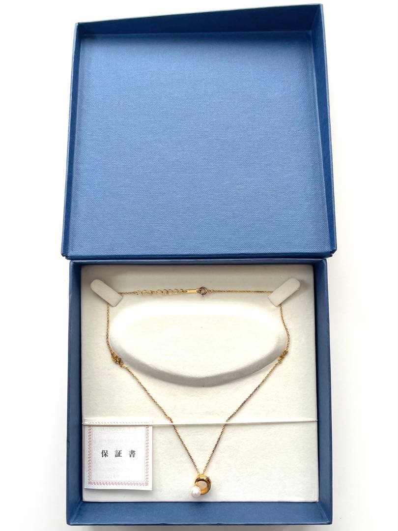 TASAKI pearl necklace in gold color with mother of pearl, displayed with box and guarantee
