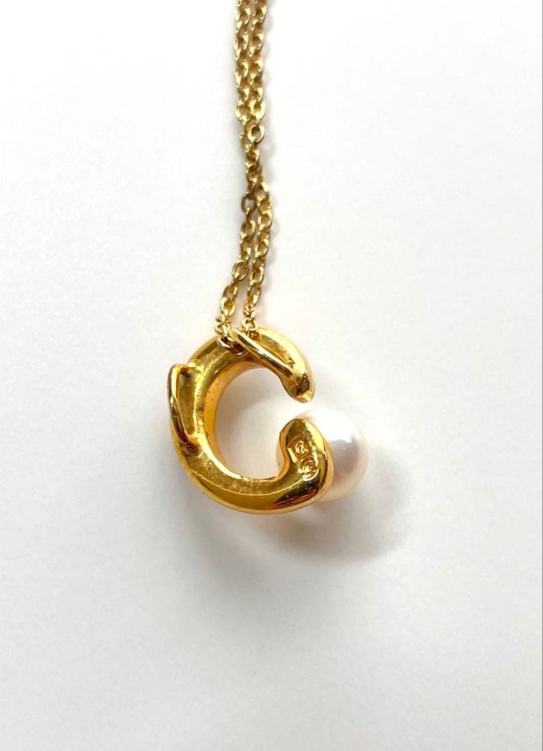 TASAKI pearl necklace in gold color with mother of pearl, displayed with box and guarantee