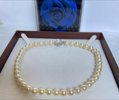 Pink pearl necklace with 9mm cowrie pearls in champagne gold color and silver clasp, 39cm length