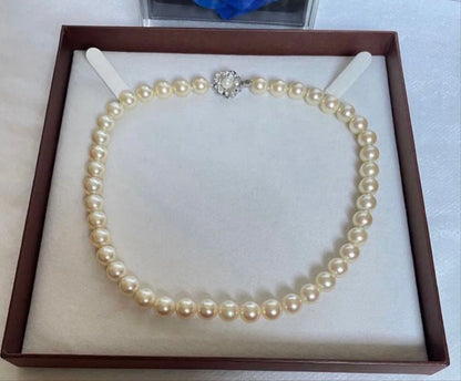 Pink pearl necklace with 9mm cowrie pearls in champagne gold color and silver clasp, 39cm length