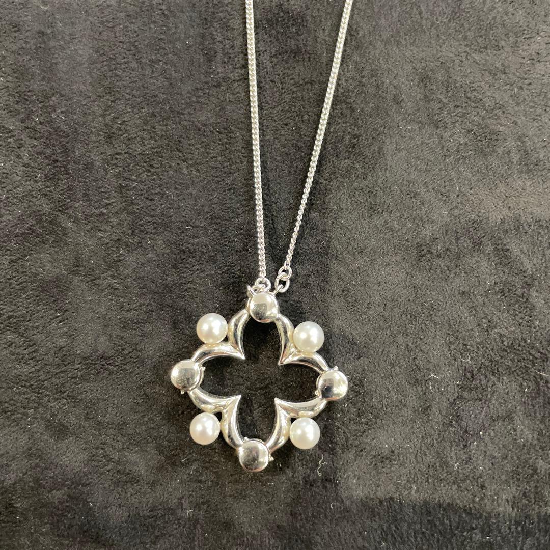 Silver pearl necklace with 200 mm length and delicate design displayed on white background