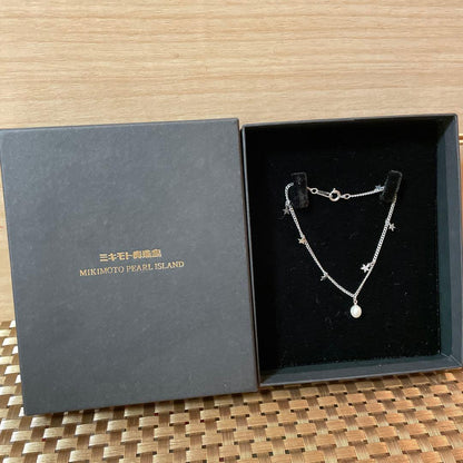 Mikimoto Pearl Island Necklace and Bracelet Set with 4mm and 5mm pearls on display